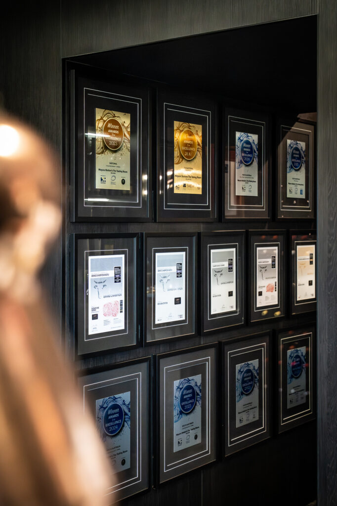 Framed awards and accolades on display at Mayura Station